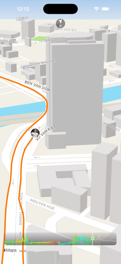 RideIQ Replay urban skyline camera angle, with 3D buildings rising around the orange traveled route line and an elevation strip below